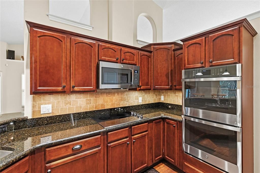 Beautiful granite counters, backsplash, and newer double wall oven and microwave.