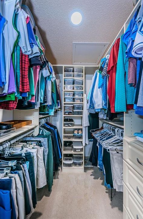 His and her California style walk-in closets