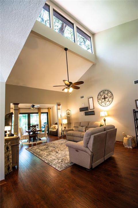 Livingroom with vaulted ceiling featuring lots of natural light