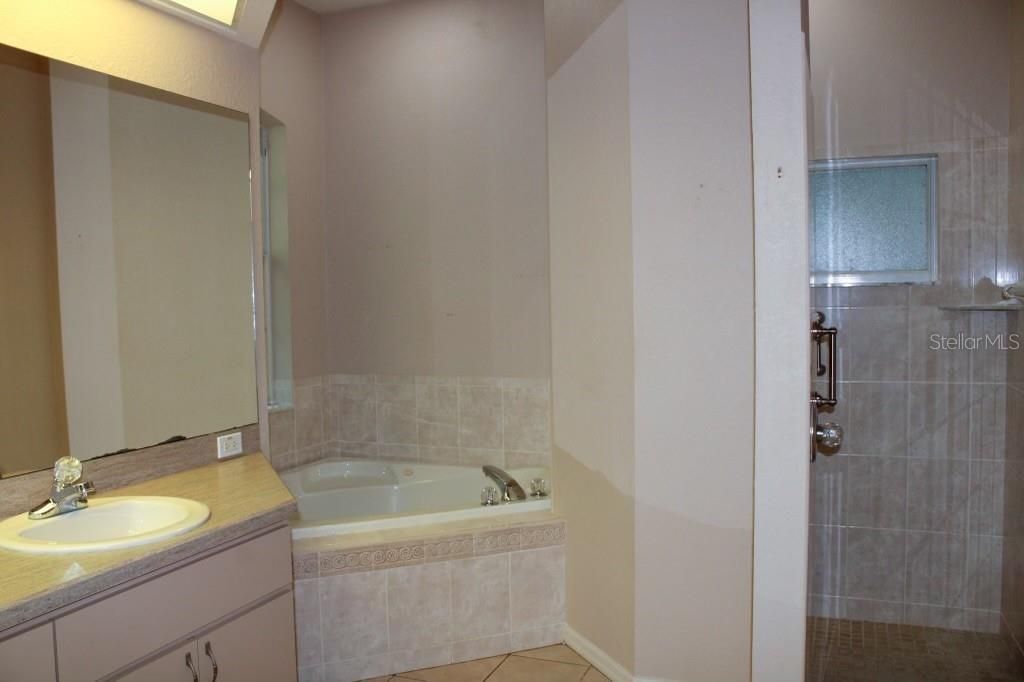 Master Bathroom with walk in shower and jetted tub