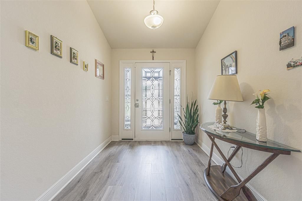 Large foyer with upgraded leaded glass front door with sidelites.
