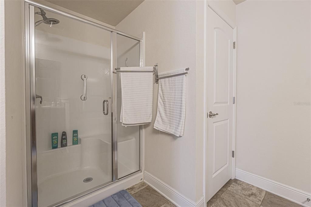 Primary ensuite bath with spacious separate shower
