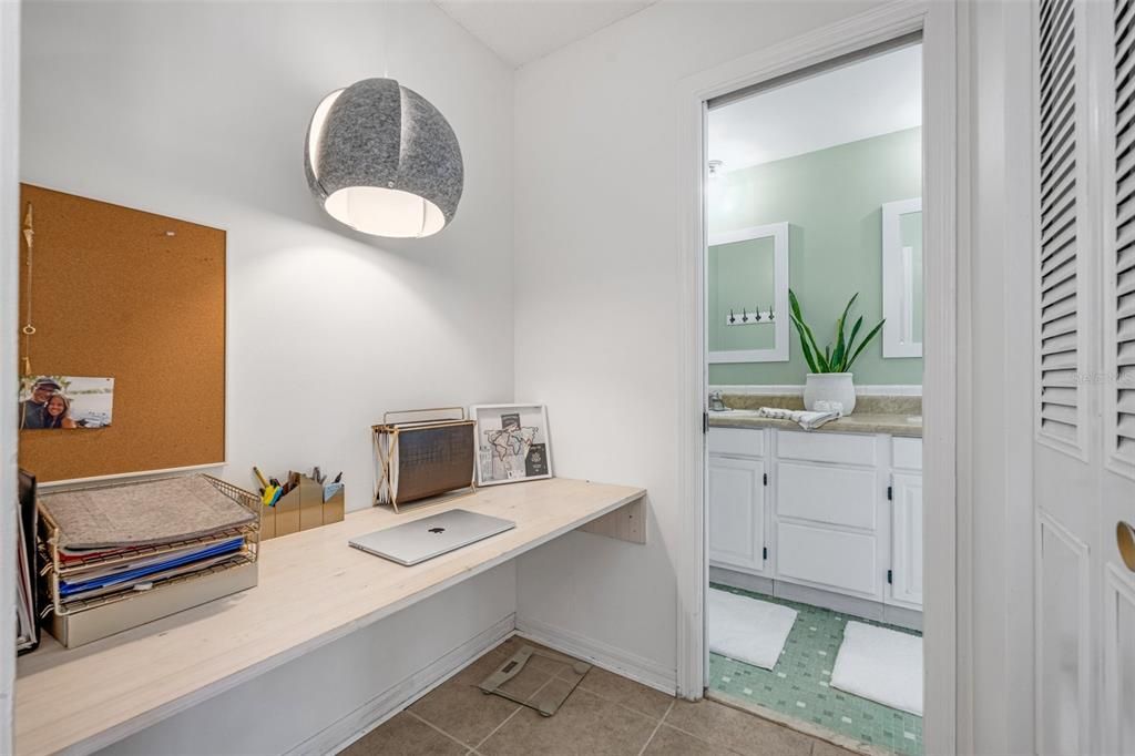 Flexibility in the nook of the primary bedroom allows the space to a be a work station, vanity area, or conversion to a second closet.