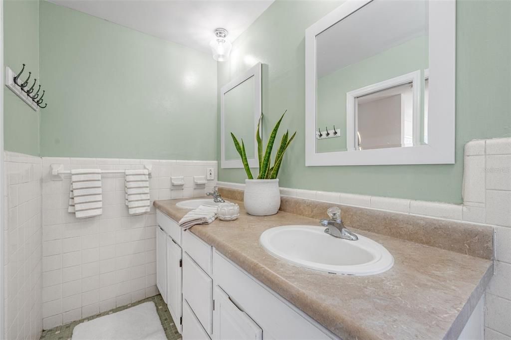 Unusually large for homes in this neighborhood, the primary bathroom even features dual sinks.