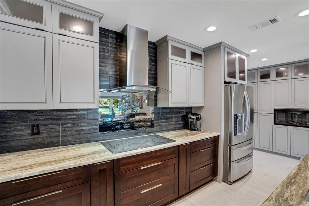 Open Kitchen with Eat-In Bar and Dining Room Table, Granite Counter tops, Custom Hardwood Cabinets and Stainless Appliances