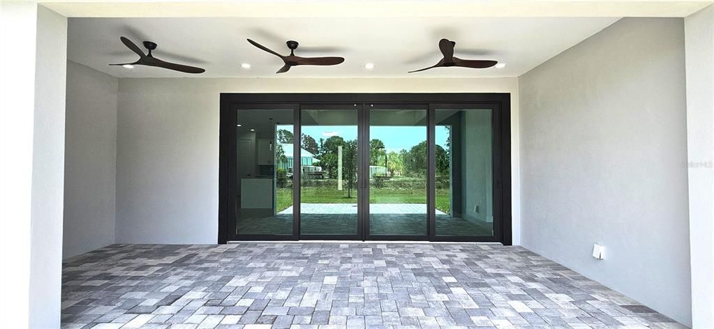 Energy efficient, low-e, double pane sliders, 3 modern ceiling fans, 8 can lighting fixtures, pavers, 2 electrical outlets