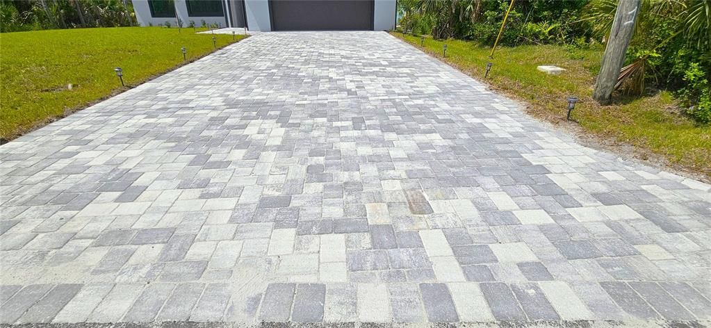Paved driveway and rear patio