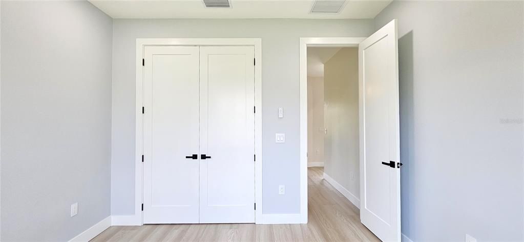 Guest bedroom #1 includes can lighting, energy efficient fan, built-in closet