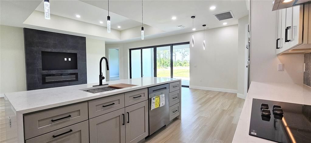 Kitchen includes all appliances including a independent wine/bottle cooler, lighting under counter, under and above cabinets, pendant lighting, external vent