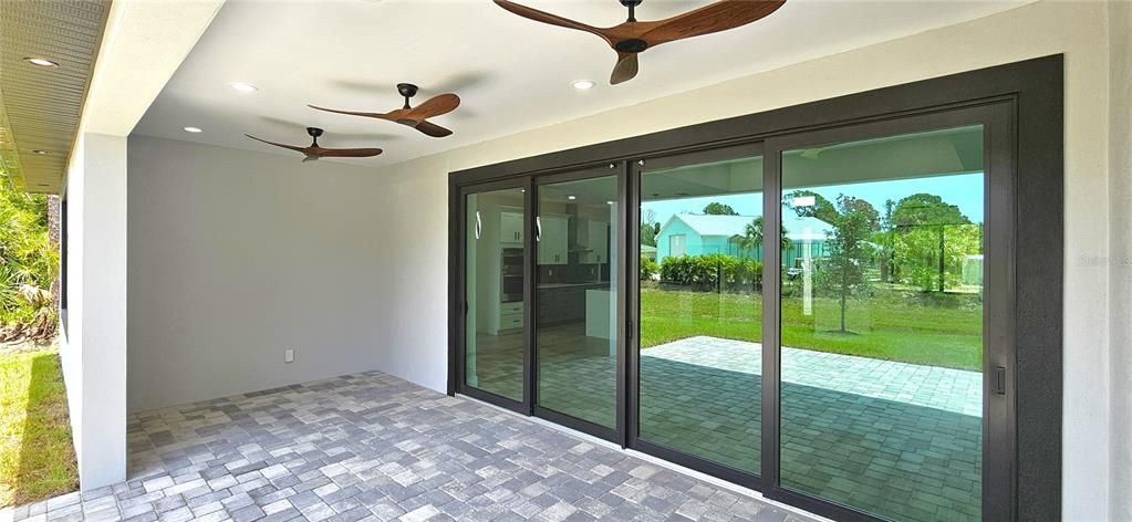Energy efficient, low-e, double pane sliders, 3 modern ceiling fans, 8 can lighting fixtures, pavers, 2 electrical outlets