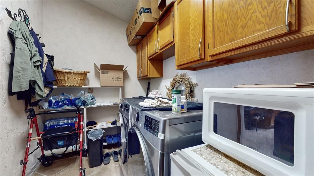 Laundry toom with wood cabinets