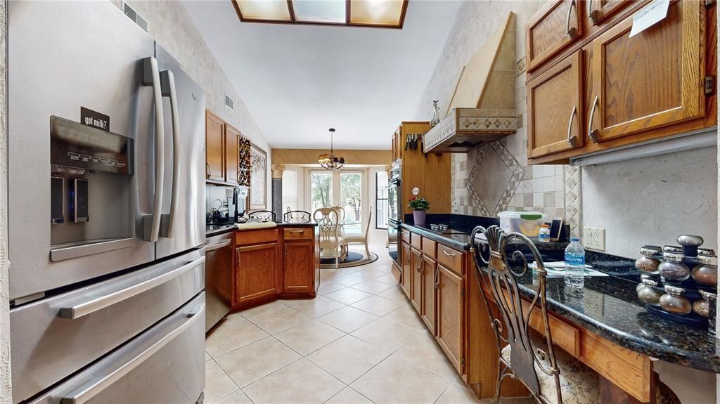 Kitchen area. Stainless steel appliances, granite counter tops.