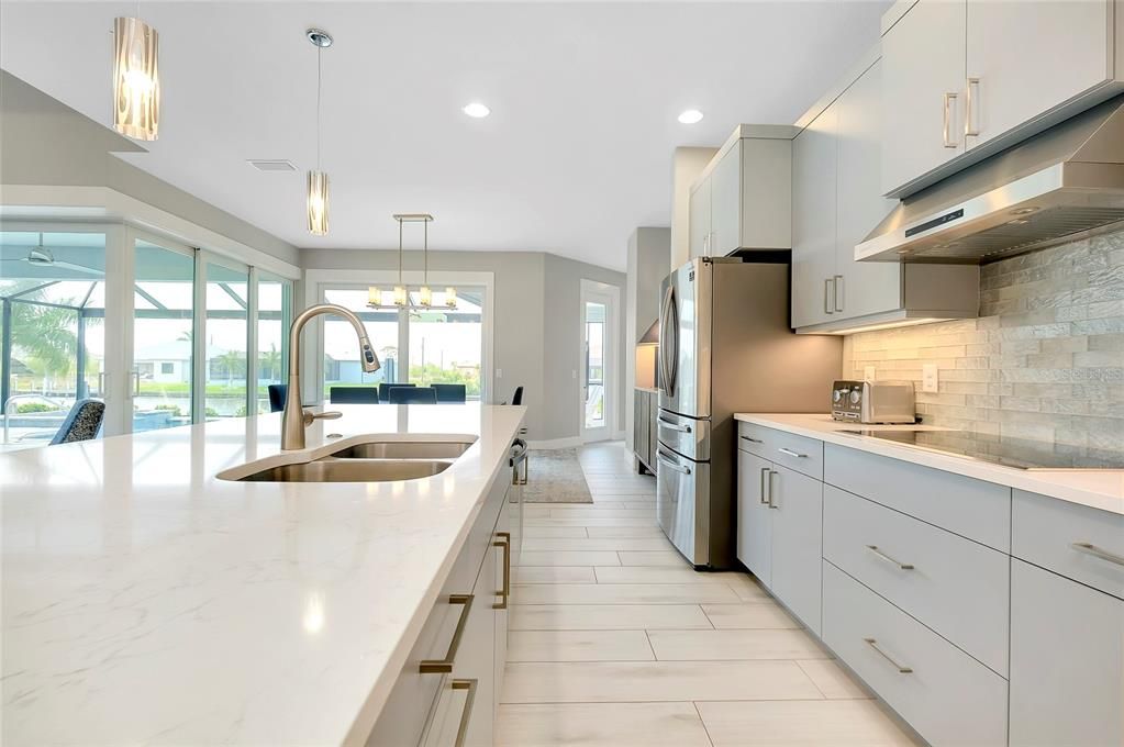 Kitchen with island and built in applicances