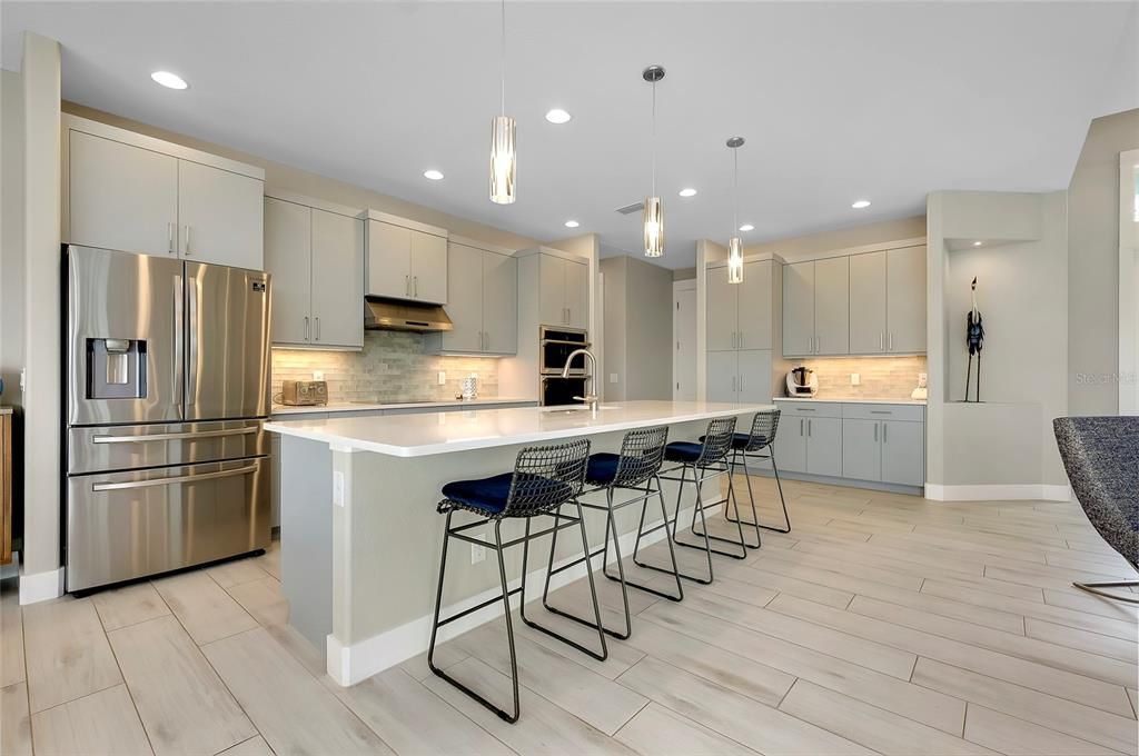 Kitchen with island and built in applicances