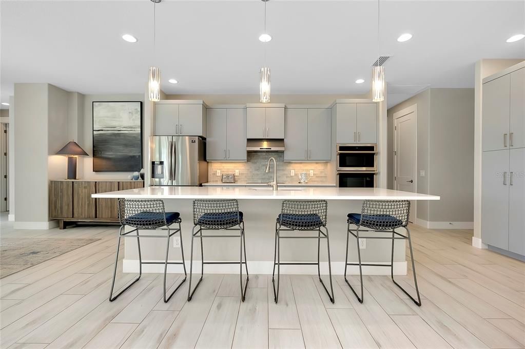 Kitchen with island and built in applicances