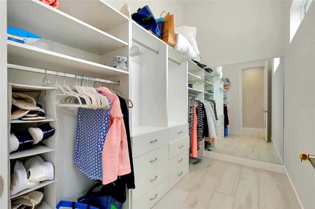 Walk in closet #1 with custom closets and windows