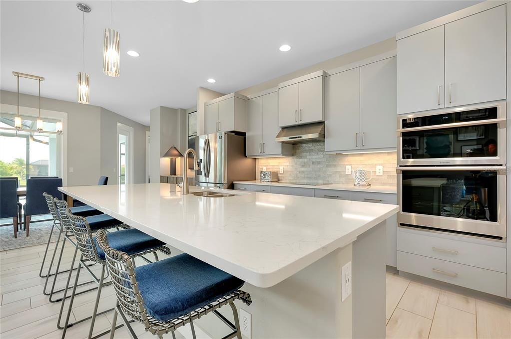 Kitchen with island and built in applicances