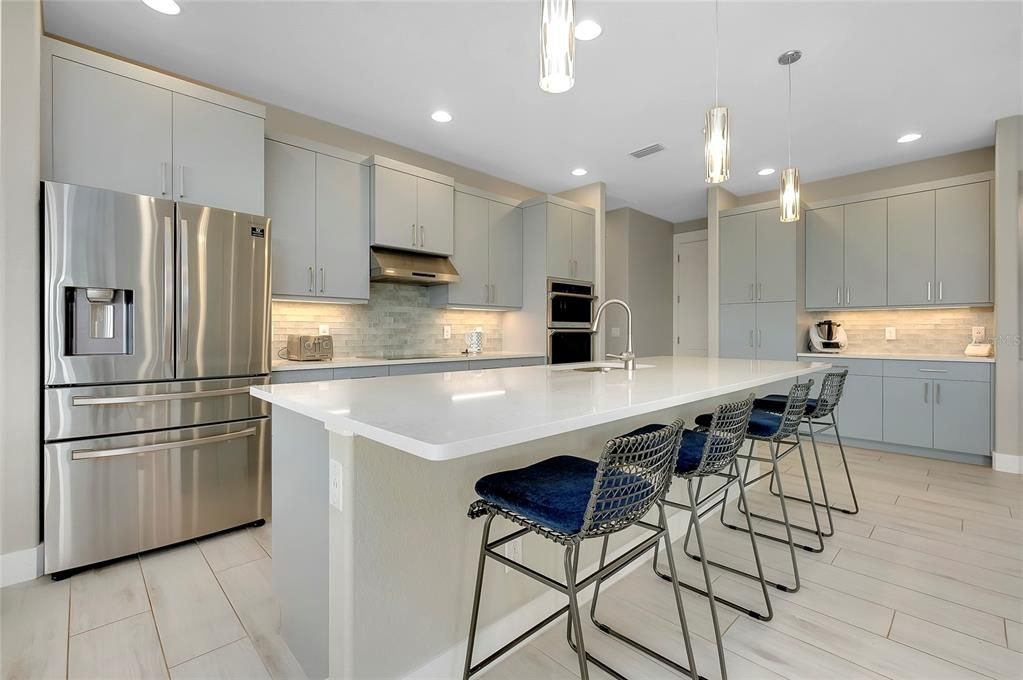 Kitchen with island and built in applicances