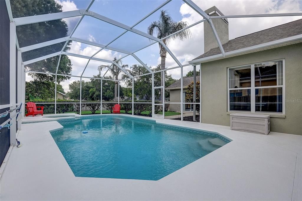 Large screened in pool w/ spa! Pool deck was just re-finished in April.