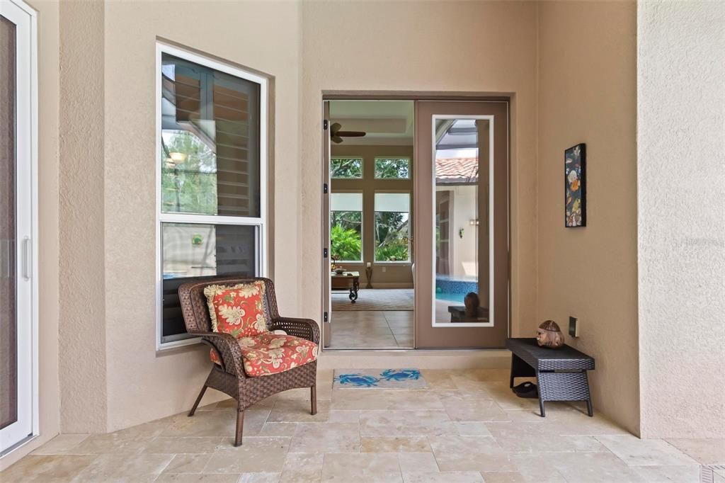 The double glass doors take you inside the house from the pool area.