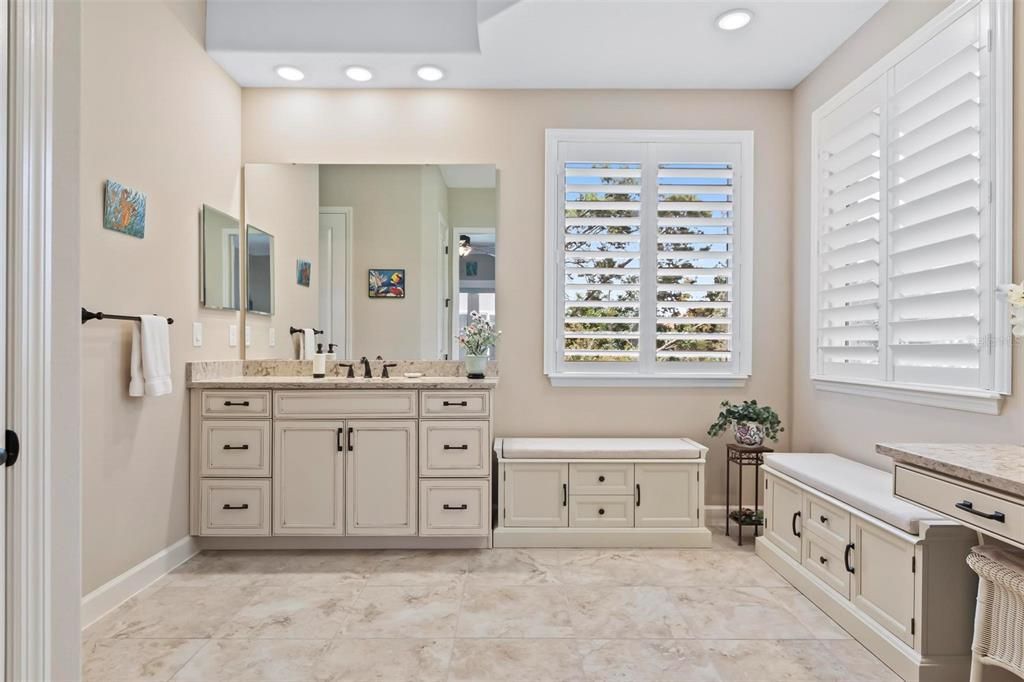 The master bath has double sinks, vanity area and sitting area on both ends plus lots of storage.