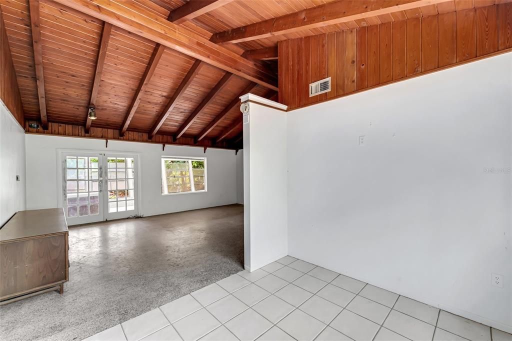 Dining rm, Living rm and rear lanai. Terrazzo floors and beautiful wood cathedral ceilings. French doors lead to rear lanai.