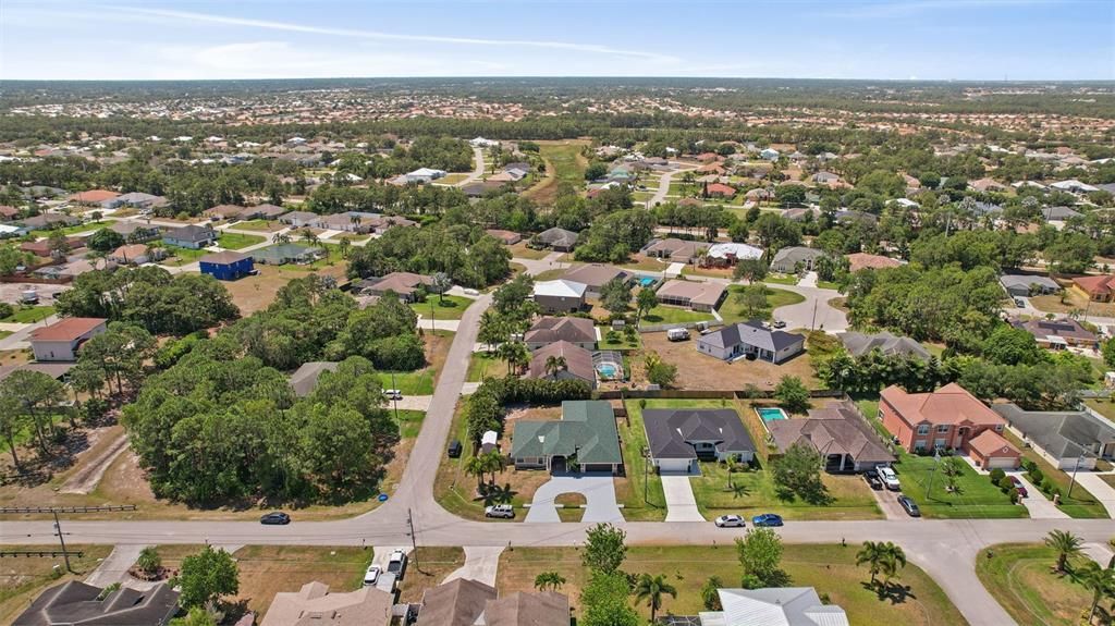 Impressive aerial view of your property from the front side. This captivating drone shot highlights the grandeur and beauty of your home's exterior and the surrounding landscape.