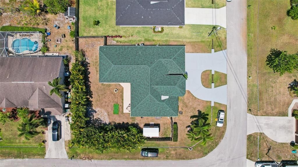 Breathtaking bird's-eye view of your property from the back. This stunning drone shot showcases the entire expanse of your home and its surroundings.