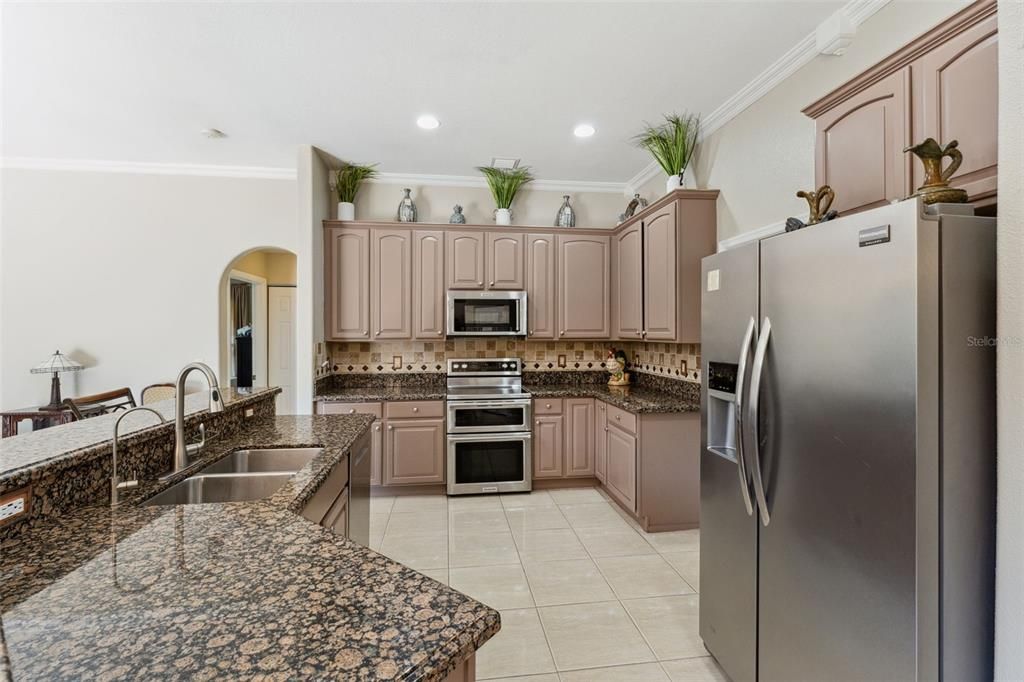 The exquisite kitchen island, complete with a sleek granite countertop.