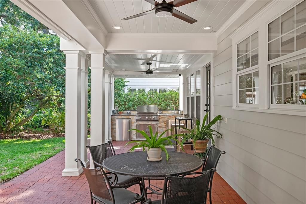 Beautiful brick pavers and an abundance of covered living space