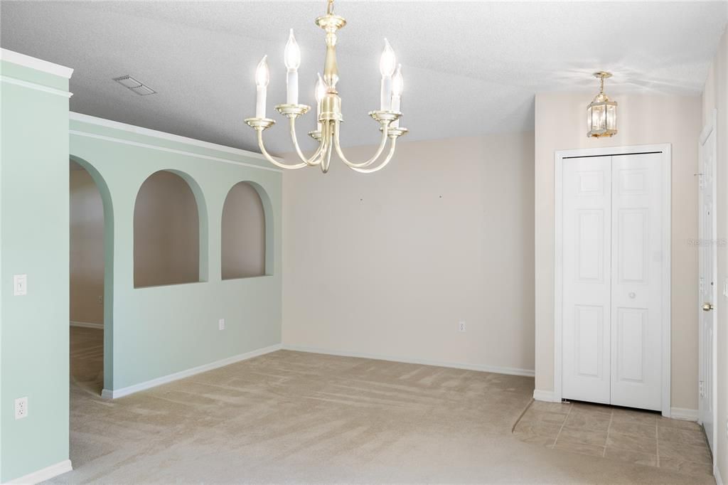 Open floorplan with sitting and dining together. Coat closet located near the front door for ease and storage