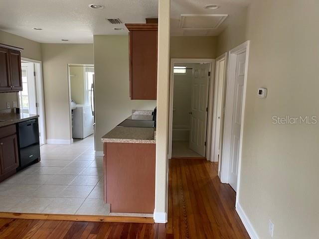 Living area looking down hallway to bedrooms and bath