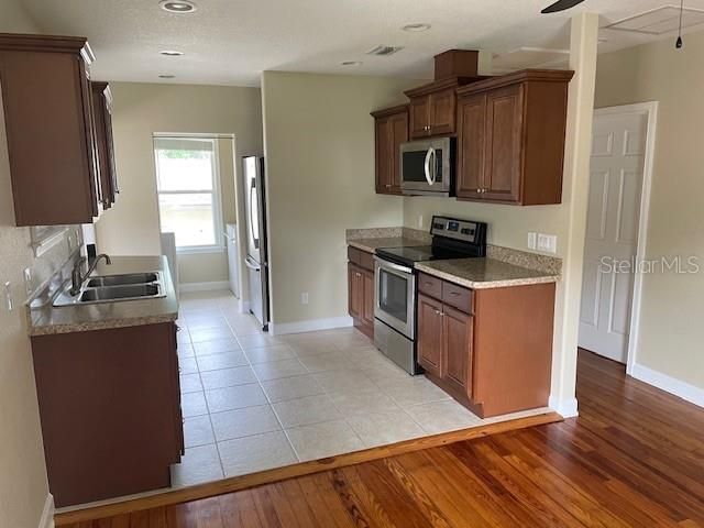 Kitchen with tile flooring and laundry area