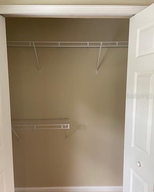 Double rod closet with shelving