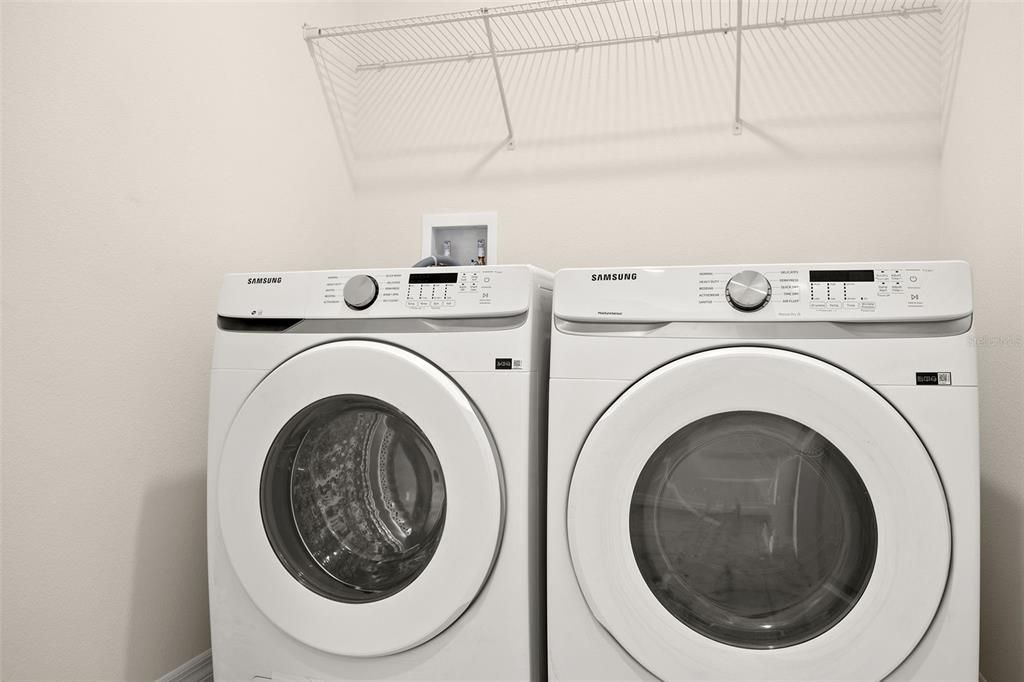Inside Laundry room with New Washer and Dryer Included with the home