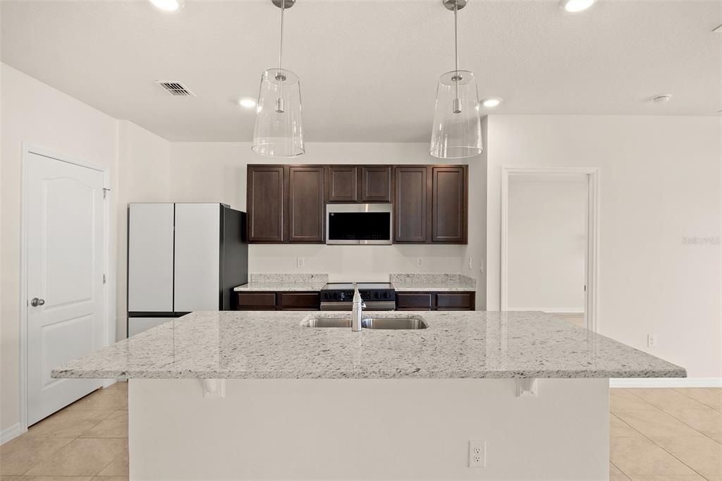 Kitchen with all New Appliances and pendant lighting
