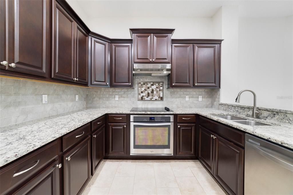 The family chef will delight in the thoughtfully updated kitchen offering a stylish color palette, granite counters. STAINLESS STEEL APPLIANCES and a great mix of cabinet and drawer storage.