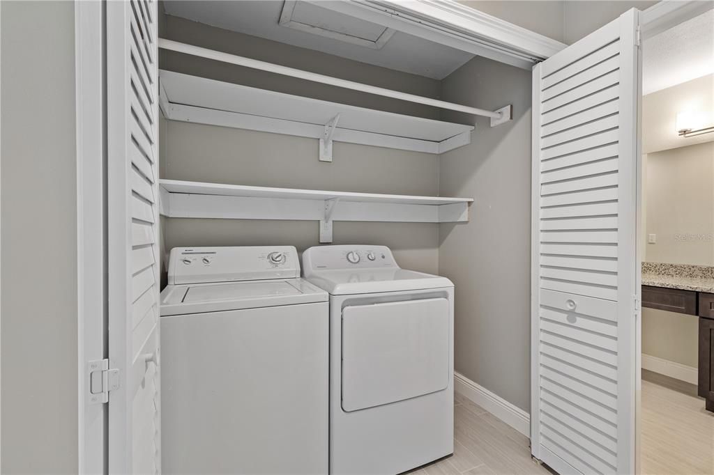 INSIDE LAUNDRY ROOM WITH WASHER & DRYER