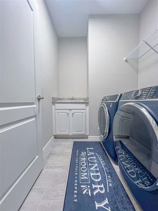 Destination laundry room with storage.