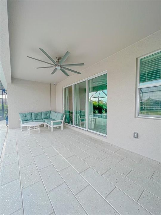 Spacious covered lanai with fan.