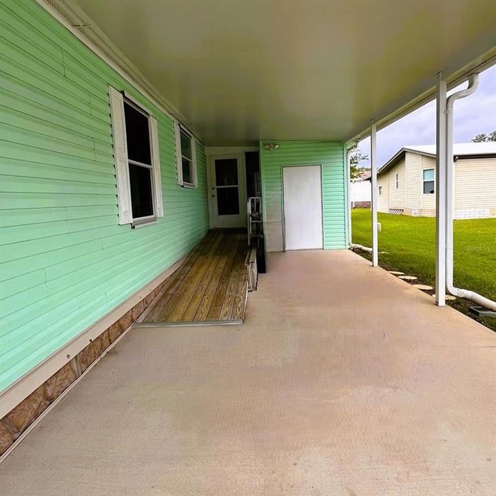 Carport with storage and ramp