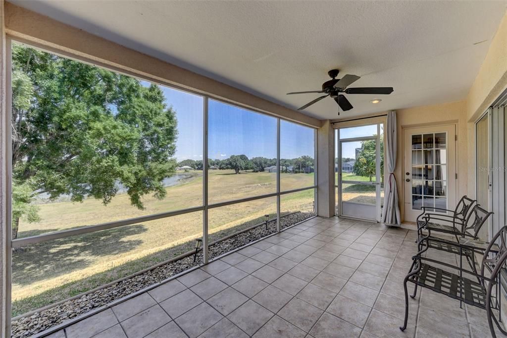 The TILED and SCREENED LANAI is the cherry on top of this lovely home, spend the day enjoying the warm weather Florida is known for or host a cookout, the view of the mature trees and lake beyond can’t be beat.