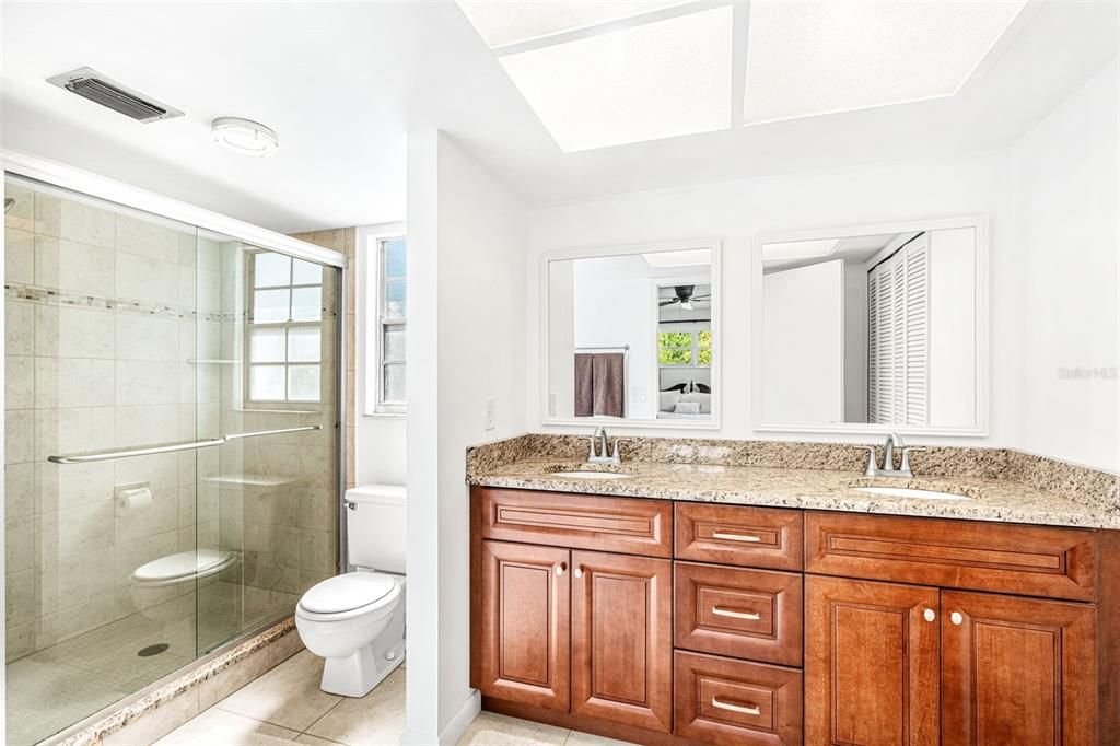 Primary Bathroom has Granite Counters and walk-in shower