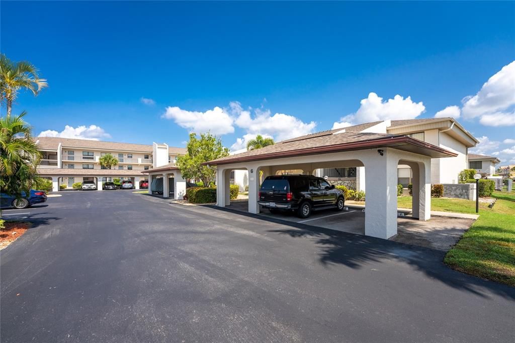 Driveway into G1.  The carport for G1 is the open slot to the right of the SUV in the nearest caport.