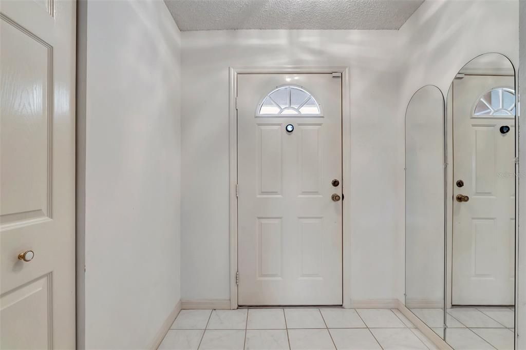 Welcoming Foyer with Coat Closet