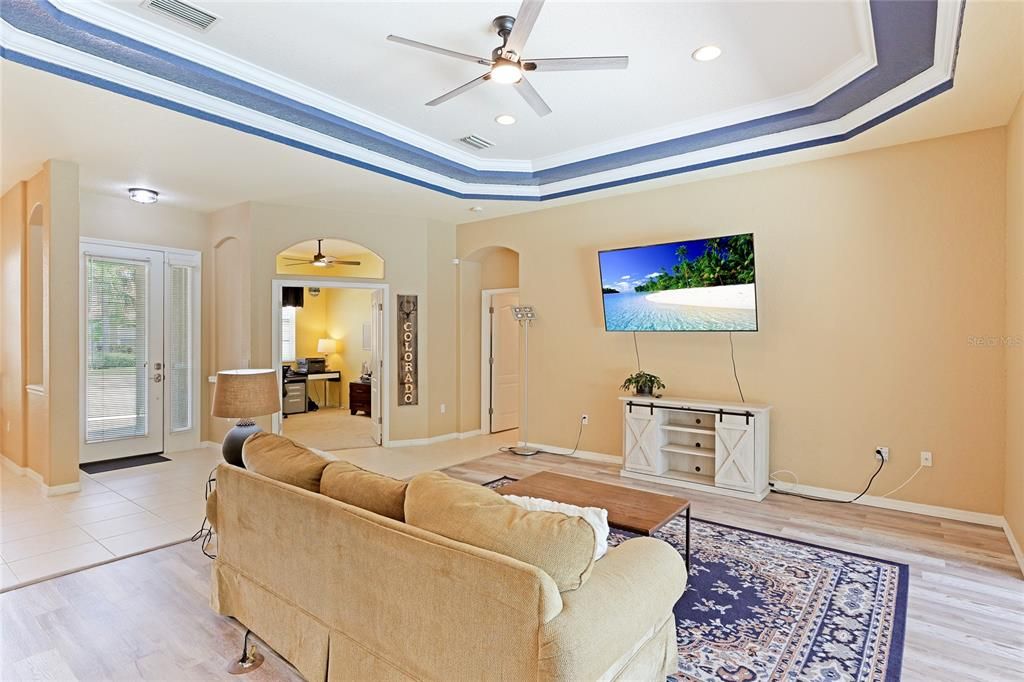 Living room overlooking the pool area and river