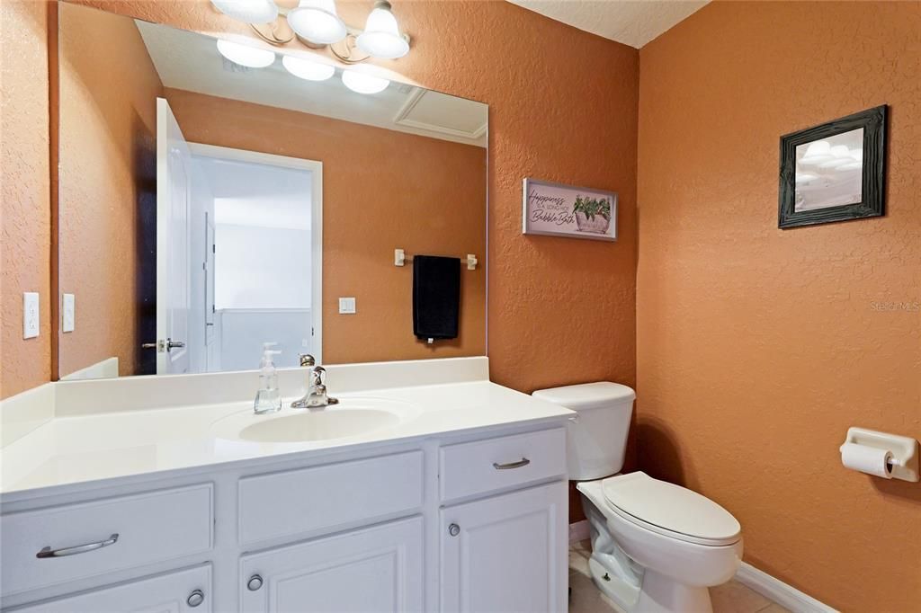 Large open bonus room upstairs with a half bath