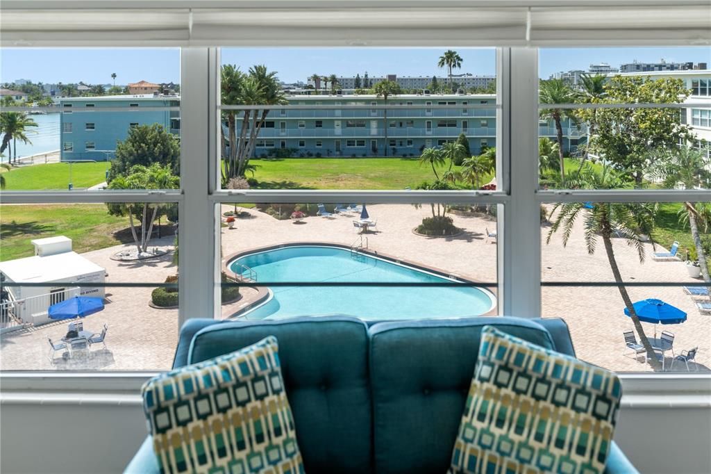 picture window overlooking pool and waterway