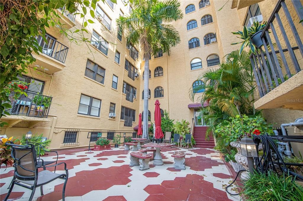 Enjoy visiting with friends in the shaded back courtyard.