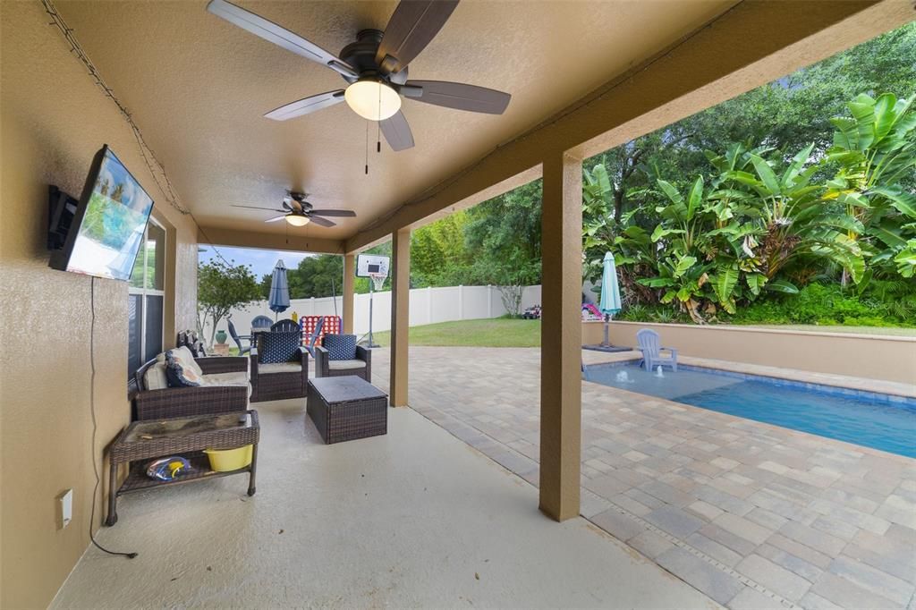 Spend the Summer poolside soaking up the sun or in the shade of the COVERED LANAI, the expansive .30 ACRE LOT gives you plenty of additional yard space and it is fully FENCED for added privacy.